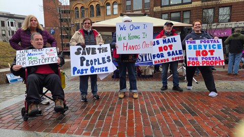 Auxiliary and friends with handmade signs